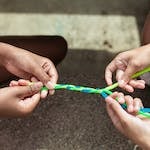 Making bracelets at summer camp